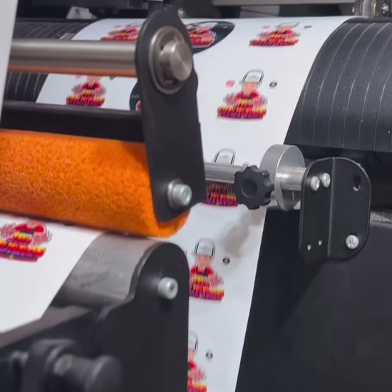 Video showcasing a roll of custom circular labels being unrolled, highlighting various designs and colors