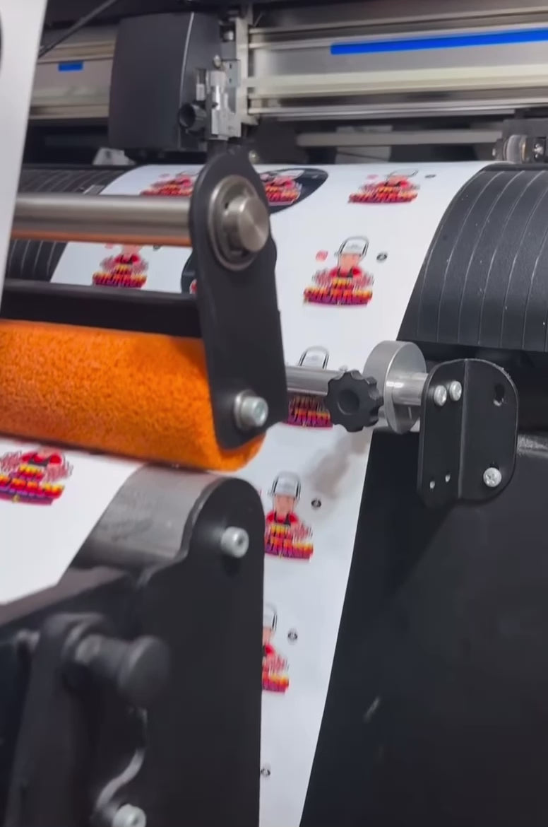 Video showcasing a roll of custom circular labels being unrolled, highlighting various designs and colors