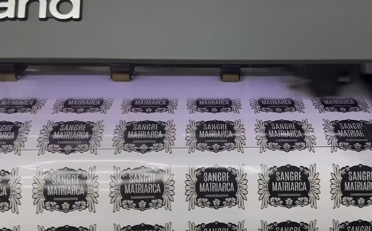 Video displaying the creation process of custom stickers, from design to printing and cutting